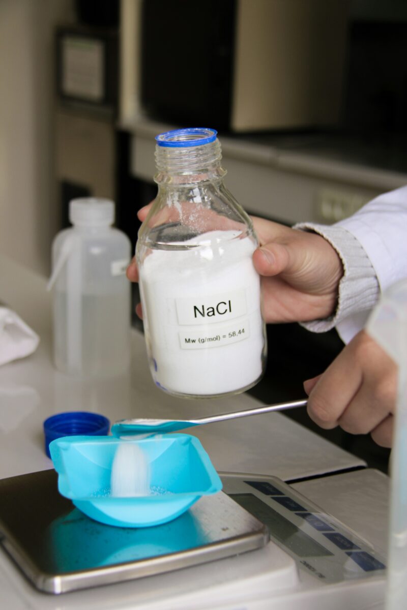 Scientist is measuring nacl (salt) in a lab.